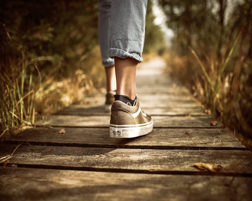 Person wearing comfortable shoes walking in the park